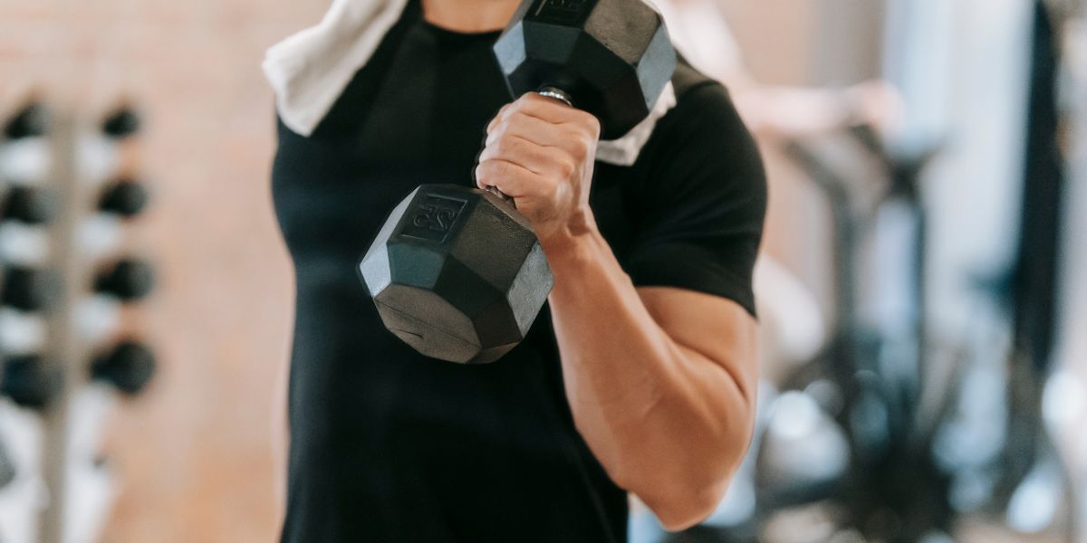 man doing dumbbell exercise