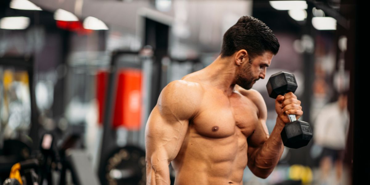 Gym person with a dumble in hand